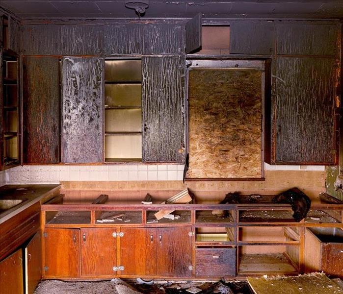 fire damaged kitchen; smoke and soot damaged cabinets